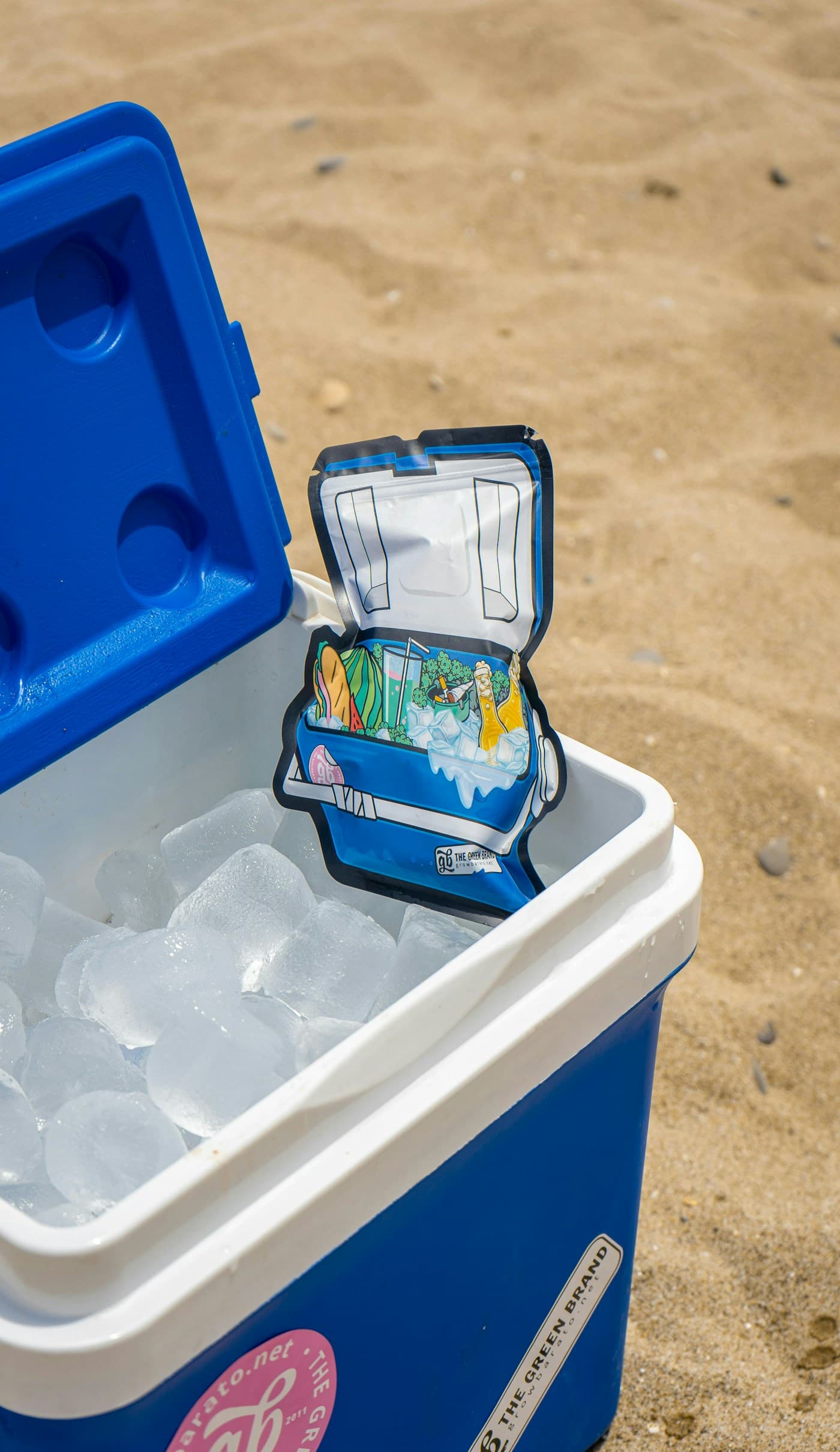 Cooler with ice on the beach